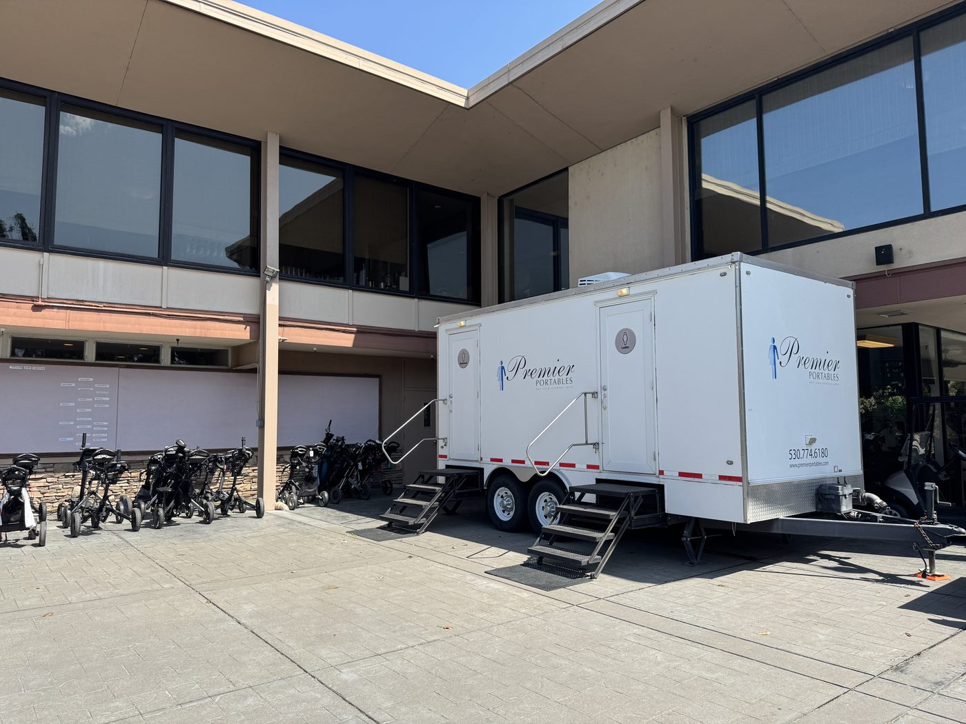 Restroom trailer positioned outside a professional commercial building in the Sacramento region