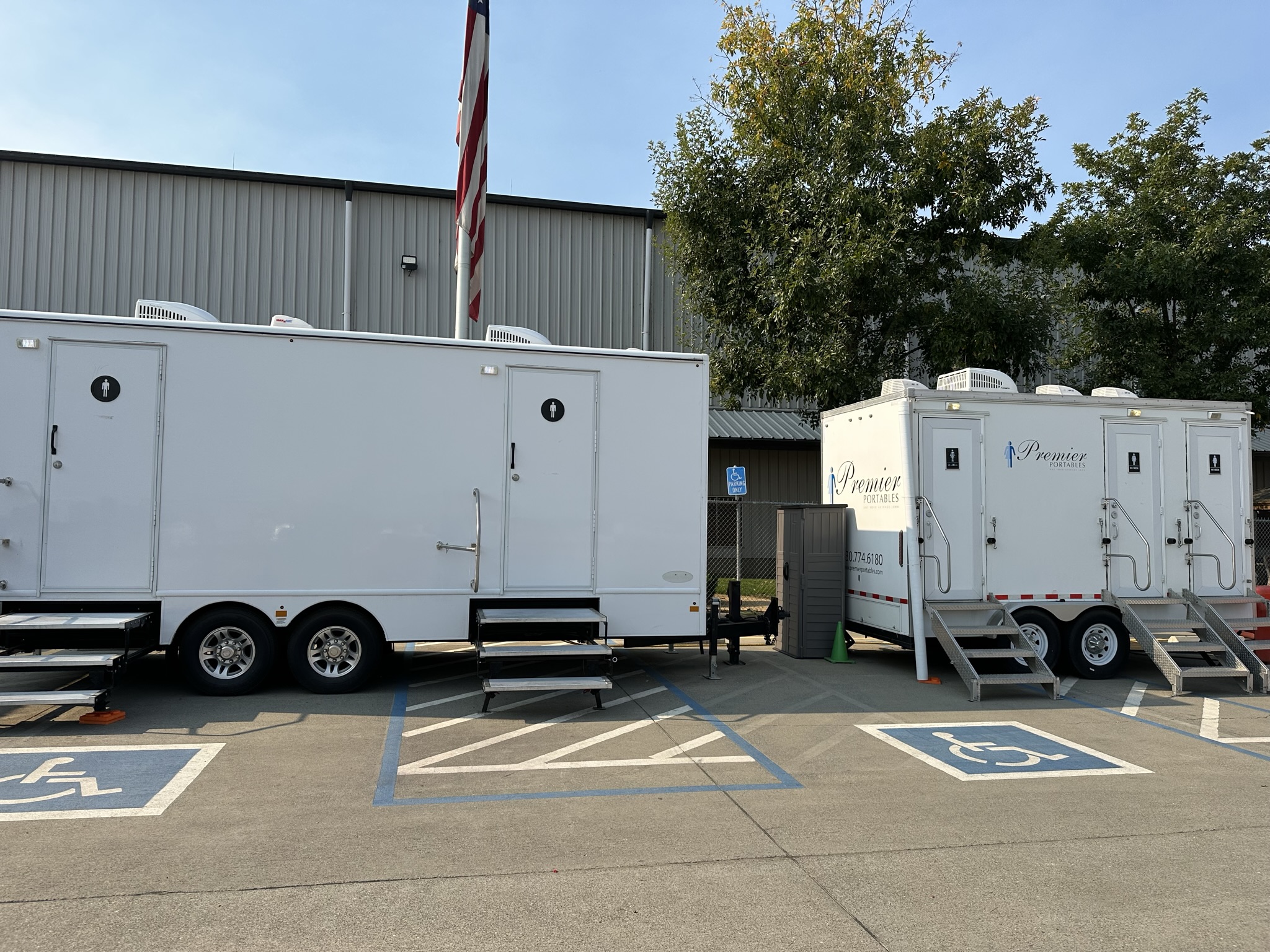 Two restroom trailers staged at a Northern California commercial job site